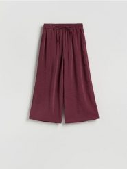 Luźne spodnie z modalem - bordowy. Czerwone spodnie materiałowe damskie Reserved, l, bez wzorów, z tkaniny. Za 119.99 zł.