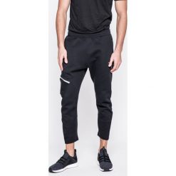 Puma - Spodnie Evo Tactile Pants Puma Black. Czarne spodnie sportowe męskie Puma, z bawełny. W wyprzedaży za 139.90 zł.
