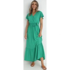 Zielona Sukienka Diomeira. Zielone sukienki damskie Born2be, l, bez wzorów, z tkaniny, eleganckie, bez kołnierzyka, bez ramiączek, maxi, kopertowe. Za 74.99 zł.