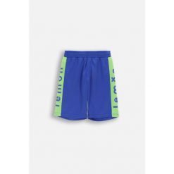 Spodenki sportowe chłopięce Lemon Explore WL6 niebieskie do kolan. Niebieskie spodnie sportowe dla chłopców LEMON explore, bez wzorów, z poliesteru, sportowe, krótkie, na fitness i siłownię. Za 49.90 zł.