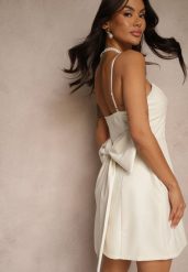 Beżowa Sukienka o Rozkloszowanym Kroju na Ramiączkach z Dużą Kokardą Ivelvia. Brązowe sukienki damskie Renee, na co dzień, m, bez wzorów, eleganckie, bez kołnierzyka, bez ramiączek, mini, dopasowane. Za 99.99 zł.