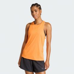 Koszulka bez rękawów z grafiką Les Mills. Fioletowe koszulki sportowe damskie Adidas, l, bez wzorów, z materiału, bez kołnierzyka, bez ramiączek, na fitness i siłownię, climacool (adidas). Za 179.00 zł.