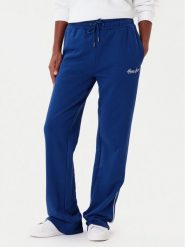 Guess Jeans Spodnie dresowe W5YB32 K68I4 Niebieski Regular Fit. Niebieskie spodnie dresowe damskie Guess Jeans, s, z aplikacjami, z bawełny. Za 299.99 zł.