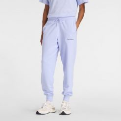 Spodnie damskie New Balance WB61D3EADYK – fioletowe. Fioletowe spodnie sportowe damskie New Balance, m, bez wzorów, z bawełny. Za 259.99 zł.