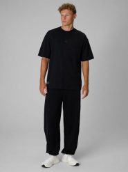 4F Regular Size: Spodnie dresowe joggery 4F | Tomasz Fornal - czarne XS. Czarne spodnie sportowe męskie 4f, m, bez wzorów, z dresówki, na fitness i siłownię. Za 199.99 zł.