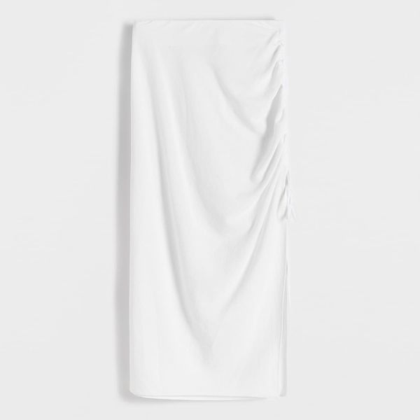 Spódnica midi - biały. Białe spódnice damskie Reserved, l, bez wzorów, z bawełny, midi, dopasowane. W wyprzedaży za 39.99 zł.