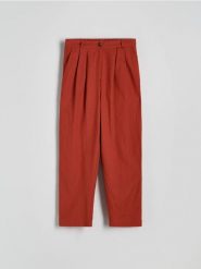 Spodnie chino z wiskozą - jasnopomarańczowy. Brązowe spodnie materiałowe damskie Reserved, l, bez wzorów, z bawełny. W wyprzedaży za 69.99 zł.