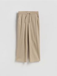 Spodnie z wiązaniem - beżowy. Brązowe spodnie materiałowe męskie Reserved, l, bez wzorów, z dzianiny. Za 119.99 zł.