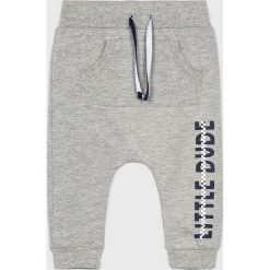 Blukids - Spodnie dziecięce 74-98 cm. Szare spodnie materiałowe dla chłopców Blukids, bez wzorów, z bawełny. W wyprzedaży za 29.90 zł.