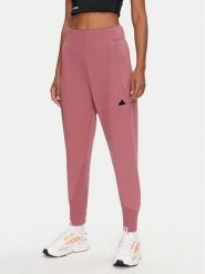 Adidas Spodnie dresowe Z.N.E. IW7771 Różowy Regular Fit. Czerwone spodnie dresowe damskie Adidas, xl, bez wzorów, z bawełny. Za 339.99 zł.