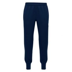 Spodnie treningowe Macron Maas. Niebieskie spodnie sportowe męskie Macron, xl, bez wzorów, z dzianiny, do piłki nożnej. Za 171.50 zł.