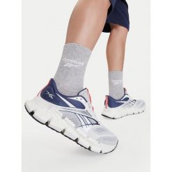 Buty do biegania Reebok. Białe buty sportowe męskie Reebok, bez zapięcia, do biegania. Za 489.99 zł.