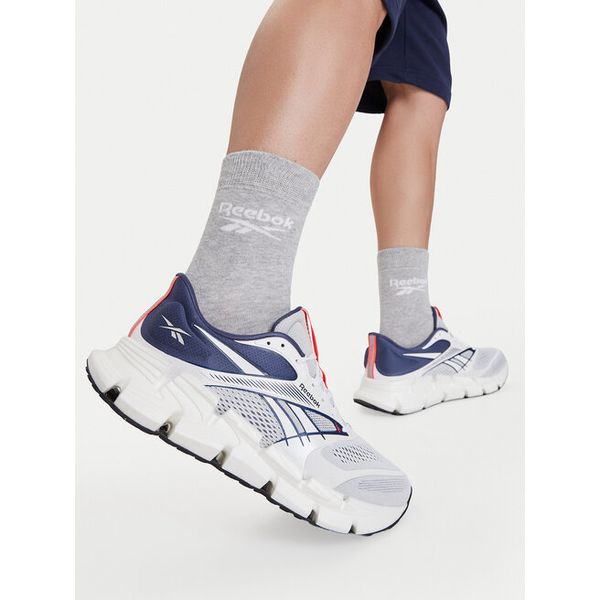Buty do biegania Reebok. Białe buty sportowe męskie Reebok, bez zapięcia, do biegania. Za 464.99 zł.