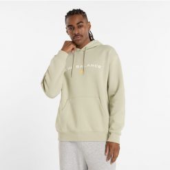Bluza męska New Balance MT51516OVN – zielona. Zielone bluzy męskie New Balance, m, z aplikacjami, z bawełny, z kapturem. Za 189.99 zł.