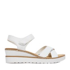 Sandały Rieker. Białe sandały damskie Rieker, bez wzorów, bez obcasa, na koturnie, bez zapięcia. Za 299.99 zł.