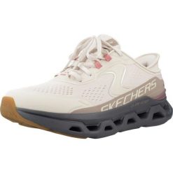Buty SKECHERS SLIP-INS GLIDE STEP ATLUS Beżowy. Brązowe obuwie sportowe damskie Skechers, bez wzorów, z syntetyku, bez zapięcia. Za 442.00 zł.