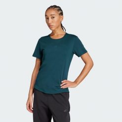 Koszulka Joga Essentials. Niebieskie koszulki sportowe damskie Adidas, uniwersalny, bez wzorów, bez kołnierzyka, bez ramiączek, na jogę i pilates, climacool (adidas). Za 149.00 zł.