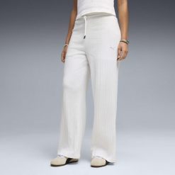 Damskie spodnie z wysokim stanem i szerokimi nogawkami HER PUMA. Białe spodnie materiałowe damskie Puma, bez wzorów, do biegania. Za 249.00 zł.