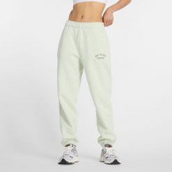 Spodnie damskie New Balance WP43500NUM – miętowe. Zielone spodnie dresowe damskie New Balance, m, z aplikacjami, z bawełny. Za 149.99 zł.