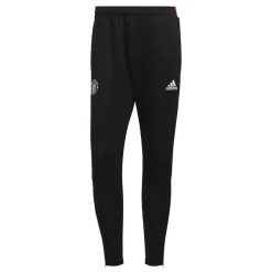 Spodnie treningowe Manchester United Tiro 2021/22. Czarne spodnie sportowe męskie Adidas, m, bez wzorów, z materiału, do piłki nożnej. Za 207.00 zł.