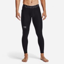 Legginsy męskie Under Armour HeatGear®. Czarne legginsy sportowe męskie Under Armour, l, bez wzorów, z materiału, długie, na fitness i siłownię. Za 129.99 zł.