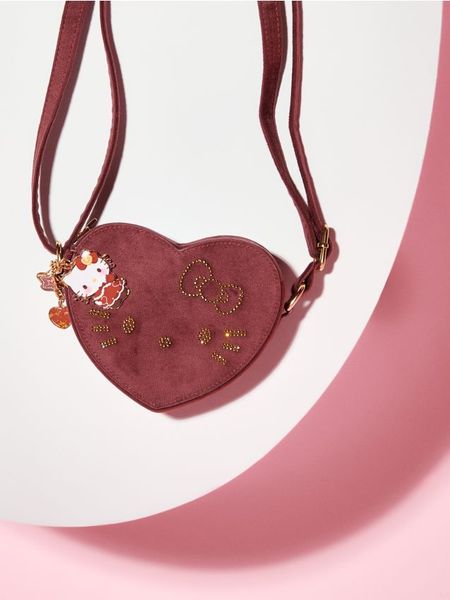 Torebka w kształcie serca Hello Kitty - bordowy. Czerwone torby i plecaki dziecięce Sinsay. Za 19.99 zł.