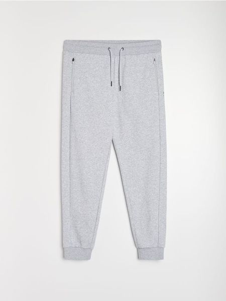 Spodnie regular fit SNSY PERFORMANCE - szary. Szare spodnie sportowe męskie Sinsay, l, bez wzorów, na fitness i siłownię. Za 59.99 zł.