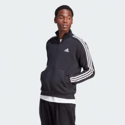 Bluza Essentials Fleece 3-Stripes 1/4-Zip. Czarne bluzy męskie Adidas, s, bez wzorów, z materiału, bez kaptura, na fitness i siłownię. Za 223.99 zł.