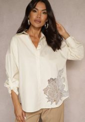 Ciemnobeżowa Koszula z Bawełny Ozdobiona Ażurową Wstawką Donivessa. Brązowe bluzki damskie Renee, l, w ażurowe wzory, z bawełny, eleganckie, bez kołnierzyka, bez ramiączek. Za 54.99 zł.