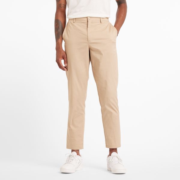 Spodnie męskie New Balance MP43554SOT – beżowe. Brązowe spodnie materiałowe męskie New Balance, m, bez wzorów, z bawełny, klasyczne. Za 349.99 zł.