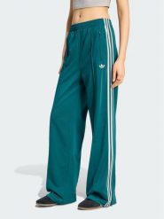 Adidas Spodnie dresowe Firebird Loose Tracksuit KS4672 Turkusowy Loose Fit. Niebieskie spodnie dresowe damskie Adidas, xl, bez wzorów, z dresówki. Za 298.99 zł.