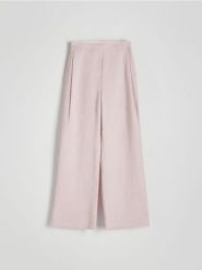 Spodnie z lnu i wiskozy - brudny róż. Czerwone spodnie materiałowe damskie Reserved, l, bez wzorów, z wiskozy. W wyprzedaży za 119.99 zł.