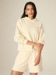 4F Bluza dresowa loose z kapturem damska - żółta L. Żółte bluzy damskie 4f, l, bez wzorów, z dresówki, sportowe, bez kołnierzyka, bez ramiączek, z kapturem. Za 159.99 zł.
