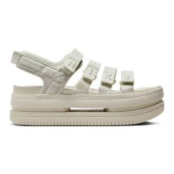 Sandały Nike Icon Classic Se FJ2595-002 beżowy. Brązowe sandały damskie bez wzorów, bez obcasa, bez zapięcia. Za 406.54 zł.