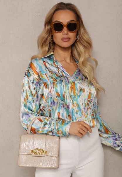 Niebiesko-Beżowa Klasyczna Koszula z Guzikami z Przedłużonymi Mankietami Keirania. Niebieskie bluzki damskie Renee, l, bez wzorów, z jeansu, eleganckie, bez kołnierzyka, bez ramiączek. Za 89.99 zł.