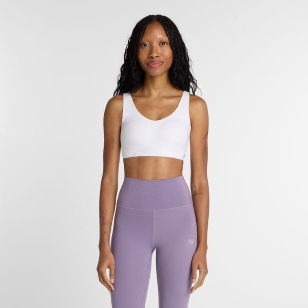 Biustonosz do biegania New Balance WB51052WT – biały. Białe biustonosze New Balance, bez wzorów, z lycry. Za 359.99 zł.