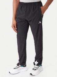 Adidas Spodnie dresowe Training Essentials Holiday JM5441 Czarny Regular Fit. Czarne spodnie sportowe męskie Adidas, l, bez wzorów, z dresówki, na fitness i siłownię. Za 258.99 zł.