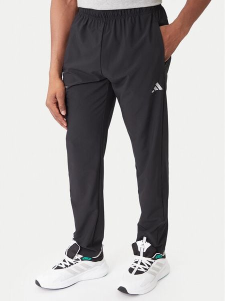 Adidas Spodnie dresowe Training Essentials Holiday JM5441 Czarny Regular Fit. Czarne spodnie sportowe męskie Adidas, l, bez wzorów, z dresówki, na fitness i siłownię. Za 258.99 zł.