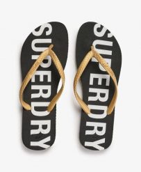Superdry Klapki Code Essential z gumy – Czarny/Złoto metaliczne. Czarne klapki damskie Superdry., bez wzorów, z gumy, bez obcasa. Za 93.90 zł.