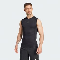Kompresyjna koszulka treningowa bez rękawów TECHFIT. Czarne koszulki sportowe męskie Adidas, xl, bez wzorów, z materiału, bez kołnierzyka, bez ramiączek, techfit (adidas). Za 139.00 zł.