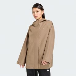 PARKA PRZECIWDESZCZOWA ESSENTIALS. Czarne parki damskie Adidas, l, bez wzorów, z materiału, biznesowe, bez kaptura. Za 439.00 zł.
