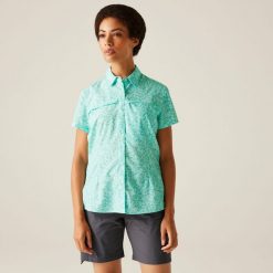 Travel Packaway damska koszula z krótkim rękawem. Białe koszule damskie Regatta, bez wzorów, eleganckie, bez kołnierzyka, bez ramiączek. Za 232.00 zł.