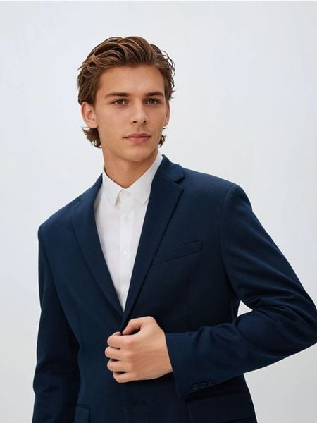 Marynarka slim fit - granatowy. Niebieskie marynarki męskie Reserved, bez wzorów, z dzianiny. Za 259.99 zł.