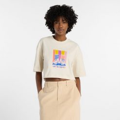 Koszulka damska New Balance WT53904LIN – beżowa. Brązowe t-shirty damskie New Balance, l, bez wzorów, z bawełny, klasyczne, bez kołnierzyka. Za 169.99 zł.