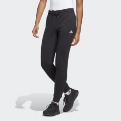 Spodnie dresowe adidas Essentials Linear French Terry Cuffed. Białe obuwie sportowe damskie Adidas, s, bez wzorów, z dresówki, na fitness i siłownię. Za 199.00 zł.