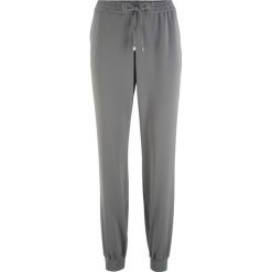 Spodnie sportowe z wygodnym paskiem bonprix szary. Spodnie dresowe damskie bonprix. Za 59.99 zł.