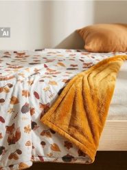 Koc z motywem jesiennym - pomarańczowy. Brązowe kocyki dla dzieci Sinsay. Za 35.99 zł.