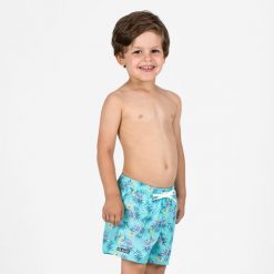 Spodenki surfingowe dla dzieci Olaian 100 Palm. Niebieskie kąpielówki dla chłopców OLAIAN, bez wzorów, z materiału, krótkie. Za 29.99 zł.