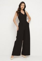 Czarny Kombinezon Taliowany Ozdobiony Guzikami Niladwenna. Czarne sukienki damskie Born2be, m, bez wzorów, eleganckie, bez kołnierzyka, bez ramiączek. Za 129.99 zł.