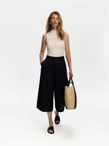 Spodnie culotte z lnu - czarny. Czarne spodnie materiałowe damskie Reserved, l, bez wzorów. Za 149.99 zł.